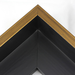 This Large, L-shaped floating contemporary canvas frame in matte black features a thin brushed gold face.

*Note: These solid wood, custom canvas floaters are for stretched canvas prints and paintings, and raised wood panels.