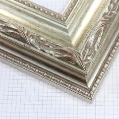 This 3-3/4 " silver leaf ornate frame showcases an opulent design with intricate floral detailing and a richly layered profile for a truly luxurious presentation. Its radiant silver finish and classic craftsmanship make it an exceptional choice for fine art, mirrors, portraits, and traditional interiors.