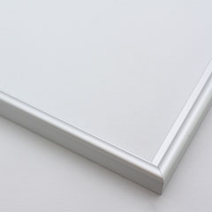 This simple metal picture frame has a smooth, frosted silver finish and curved profile. The outer drop edge has a tiny vertical ridge texture. 

.375 " width: ideal for small, medium or large artworks. Easily frame photographs, paintings or drawings on paper, or even Giclée canvas prints.