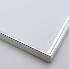 This simple metal picture frame has a silver, high-shine finish, brush-textured drop edge and a curved profile.

.375 " width: ideal for small and medium artworks. Easily frame photographs, thicker cloth or needlework art, or even Giclée canvas prints.