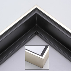 This solid wood canvas floater picture frame features a shiny brushed silver on the outside edge and narrow face.  The long inside step and base are a matte black. 

Display your favourite gallery wrapped canvas Giclée print or oil painting with authentic, fine art style. This canvas floating frame is ideal for large, thich (1.5 " deep) canvas images.

*Note: These canvas floaters are for stretched canvas prints and paintings, and raised wood panels.
