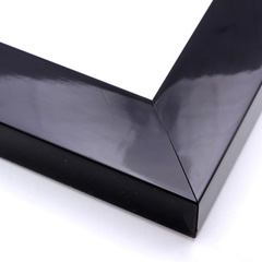 This dense, deep frame in high shine solid black features a .75 " inner edge, creating a strong shadow and sense of depth around the artwork.

2 " width: ideal for medium and large images.  Select a strong piece of art for this frame, to keep the border from overpowering the image.