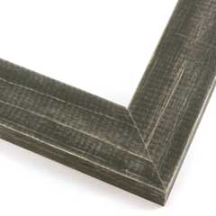 This simple, flat faced frame features rustic wood lightly coated in charcoal grey/black paint.  The top coat is rubbed away in places to reveal the natural wood color below, for a soft, antiqued look.

1-1/2 " wide: ideal for small and medium-size images.  Whether photography or paintings, rural scenes and simple images will look striking in this frame.