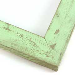 This simple, flat faced frame features real, solid wood with a pale, baby-green wash. The natural grain shows through the sanded varnish, giving the frame a soft, antiqued appearance with a pop of color.

1-1/2 " wide: ideal for small to mid-sized images. Rural painting or children