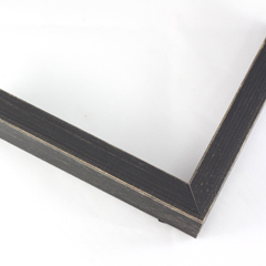 This simple, flat faced frame features rustic wood lightly coated in charcoal grey/black paint.  The top coat is rubbed away in places to reveal the natural wood color below, for a soft, antiqued look.

3/4 " wide: ideal for small and medium-size images.  Whether photography or paintings, rural scenes and simple images will look striking in this frame.