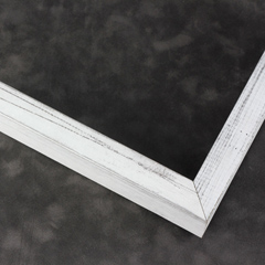 This simple, flat faced frame features rustic wood lightly coated in white paint.  The top coat is rubbed away in places to reveal the natural wood color below, for a soft, antiqued look.

3/4 " wide: ideal for small and medium-size images.  Whether photography or paintings, rural scenes and simple images will look striking in this frame.