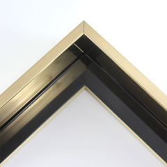 Classic L-shaped 1-1/2 " floater frame. This frame is bright gold with a mirrored finish. The inside base of the frame is high gloss mars black. A very slight horizontal grain pattern is visible in only certain light and viewing angles.
