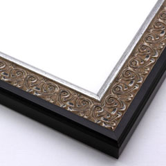 An ornate, solid wood frame featuring an intricate design overlaid with elegant silver leaf, and lightly antiqued.  A shallow scooped profile and unadorned inner edge draw the eye inward. A dark brown outer edge highlights the design.  

1.75 " width: ideal for medium-sized artworks.  Oil paintings, prints and formal family photos will be equally at home encased in this traditional frame.