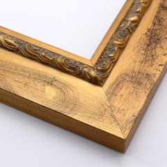This flat profile, solid wood frame features a scroll and dot relief design topped with gold leaf, along the inner edge.  The wide surrounding edge mimics brushed gold.  

2.5 " width: ideal for larger images.  Highlight a traditional black and white photograph, oil painting or Giclée print.  The extension of the flat outer edge beyond the relief detail ensures the frame will not detract from your image.