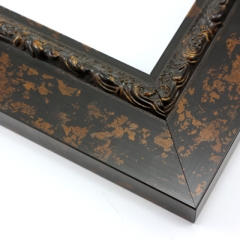 This flat profile, solid wood frame features a scroll and dot relief design along the inner edge.  The entire frame is a matte black with copper touches.  

2.5 " width: ideal for medium to extra large images.  Highlight a traditional black and white photograph, oil painting or Giclée print.  The extension of the flat outer edge beyond the relief detail ensures the frame will not detract from your image.