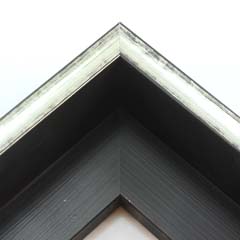 This glossy silver canvas floater frame has a U-shaped scoop face (just over 1/2 " wide) with black distressed scratching. The drop edge is black with a subtle, lined texture.

1-1/2 " rabbet depth: ideal for 1-1/2 " gallery wrapped canvas of medium or large size.  This frame looks equally striking bordering oil or acrylic paint prints and photographic prints.