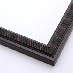 This simple, slim frame features a ridged, wave design with a beveled inner lip and smooth outer edge. The dark brown base is highlighted with a bronze patina on the top of the ripples and brushed along the flat edge.

1.25 " width: ideal for small to medium size images.
