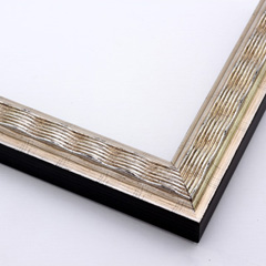 This simple, slim frame features a ridged, wave design with a beveled inner lip and smooth outer edge. A silver base is lightly antiqued with a black patina and burnishing.  The outside drop edge is solid black.

1.25 " width: ideal for small to medium size images.