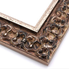 This ornate, intricate frame features a bold relief design in gold and black-mottled, antique silver foil, to match the raised, roughly textured silver foil inner lip.

2.75 " width: ideal for large images.  Select a strong piece of artwork to avoid having it overpowered by this decadent frame.
