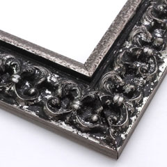 This ornate, intricate frame features a bold relief design in a black-mottled antique silver foil. The raised, roughly textured inner lip is silver foil as well.

2.75 " width: ideal for large images.  Select a strong piece of artwork to avoid it being overpowered by this decadent frame.