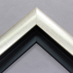 This high shine, silver foil floater frame features a thick curved profile.  A brushed finish reveals subtle lines and faint black spattering gives an antique look - simple, yet glamorous. A 1 " rabbet gives this frame a shadow-box quality.

Ieal for medium-sized and large images.  Select an oil or watercolour painting, print, or abstract photograph.