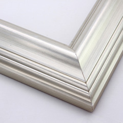 This high swan profile wood frame features a reverse slope and 1.5 " maximum depth.  The gentle ridges are encased in glossy silver foil - an elegant but simple design.

2.5 " width: ideal for medium and large images.  Pair with old, grayscale portraits and bold paintings or Giclée prints.