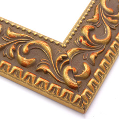 A large, reverse curve profile frame with an intricate leaf design bordered by a geometric outer edge and beaded inner lip.  A matte and gold foil base features bronze patina for added depth on the topmost points of the design. Strong, solid wood construction.

2.75 " width: ideal for large and extra large images.