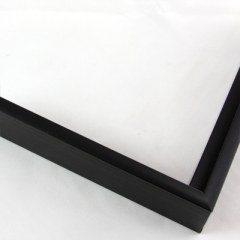 Slim 5/16 " metal frame. This frame comes in solid mars black. The face has a frosted texture and reflects dispersed light. The profile features a horizontal brushed texture.

Nielsen n22-21 Profile