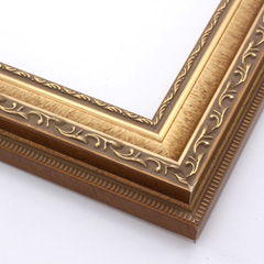 This highly detailed, solid wood frame features three distinct designs.  The dominant design tops a deep scoop of smooth, brushed gold foil and meets a small detail on the inner lip.  A drop ledge on the outer edge is decorated in a simple dash.  Matte areas within the designs create an antiqued look.

2 " width: ideal for medium- to large-size images. The detailed nature of this frame makes it suitable for bright or busy paintings or photographs.  It may overpower simpler images.