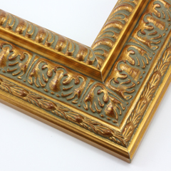 This highly detailed gold leaf frame features a wide, reverse stepped profile with three distinct designs.  A brushed effect reveals a deep red undercoat and gives the frame an antique appearance.

3 " width: ideal for large and oversize images.  This frame can hold its own against a detailed painting or print, but may overshadow a simpler image.