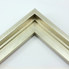 This stair step wood floater frame with a high shine lets your canvas hover neatly within the simple, modern border. The frame features a brushed silver finish with a steep upper and small lower step. The iridescent color varies slightly in different light, running from warm, muted gold to cool, opaque silver.

Give an authentic, fine art display to your favourite Giclée print or oil painting. This size is ideal for thin (3/4 " deep) gallery wrap canvases. The canvas may protrude slightly above the frame face. 

*Note: These solid wood, custom canvas floaters are for stretched canvas prints and paintings, and raised wood panels.