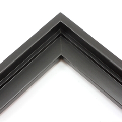 This stair step wood floater frame has a matte black finish with a steep upper and small lower step. The canvas will hover neatly within the simple, modern border. 

Give an authentic, fine art display to your favourite Giclée print or oil painting. This size is ideal for thin (3/4 " deep) gallery wrap canvases. The canvas may protrude slightly above the frame face. 

*Note: These solid wood, custom canvas floaters are for stretched canvas prints and paintings, and raised wood panels.