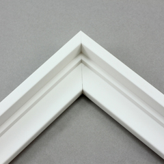 This stair step wood floater frame has a matte white finish with a steep upper and small lower step. The canvas will hover neatly within the simple, modern border. 

Give an authentic, fine art display to your favourite Giclée print or oil painting. This size is ideal for thin (3/4 " deep) gallery wrap canvases. The canvas may protrude slightly above the frame face. 

*Note: These solid wood, custom canvas floaters are for stretched canvas prints and paintings, and raised wood panels.