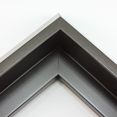 This unique floater frame for stretched canvas features a narrow, 0.5 " face that falls into a steep reverse slant toward the outer edge of the frame.  The modern style is finished in a deep brown with wood grain detailing.

Ideal for mounting thick (1.5 " deep) gallery wrapped canvas portraits, paintings or Giclée prints. The canvas will extend slightly farther than the face of the frame.  The vintage, subtly rustic look pairs nicely with bucolic or nature image.

*Note: These solid wood, custom canvas floaters are for stretched canvas prints and paintings, and raised wood panels.