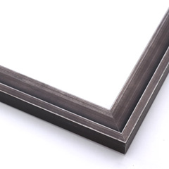 This simple, stepped profile frame features solid wood overlaid with a blackened silver foil.  This heavy antiquing gives the otherwise plain frame a classic, charcoal look.  

1.125 " width: ideal for small images.  Border a family photograph, or a painting or print with this unique frame.