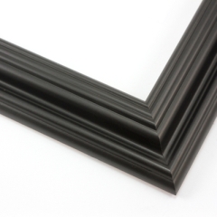 This solid wood, matte black frame features a reverse scoop profile.  The inner lip recedes in a series of curved steps into a steep dip and a raised outer edge. 

1.75 " width: ideal for medium size images.  A wide variety of photographs, paintings and prints will be enhanced within this unique frame.