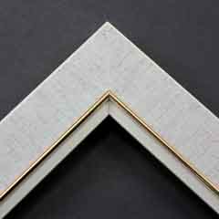 Linen liners are a great option for providing blank space between art and frame.  Where glass is generally required to protect paper artworks and their mat, a linen liner does not require glass, making it ideal for paintings and Giclée prints.

This 1.25 " natural liner has an authentic linen texture and colour, and a gold and painted white lip.  It is best suited to medium size canvas prints, watercolour or oil paintings.