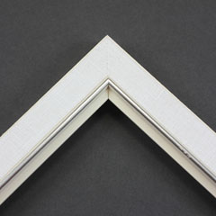 Linen liners are a great option for providing white space between art and frame.  Where glass is generally required to protect paper artworks and their mat, a linen liner does not require glass, making it ideal for paintings and Giclée prints.

This 1.25 " white liner has an authentic, soft linen texture and a silver and painted white lip.  It is best suited to small and medium size canvas prints, watercolour or oil paintings.
