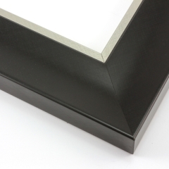 This simple, bold frame features scoop profile and matte black face with subtle crosshatching.  The inner lip is stepped down and covered in silver foil.

2.75 " width: ideal for large and extra large artworks. Due to it
