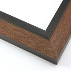 This unique frame with a raw wood face features long edge grain texture and a classic brown wash.  The frame forms a shallow V, with the matte black inner lip sloping out and then rising again (see illustration). The outer drop edge is also matte black.

2 " width: ideal for medium size artwork.  The modern style of this frame makes it a great match to more contemporary paintings and photography.
