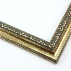 This classic, Victorian-style frame features a solid wood, reverse scoop profile.  The relief-detailed inner lip and sloped face are a textured gold foil, edged in a subtle bevel.

1.25 " width: ideal for small images. Border an acrylic or oil painting or print with this antiqued, high fashion frame.
