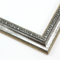 This classic, Victorian-style frame features a solid wood, reverse scoop profile.  The relief-detailed inner lip and sloped face are a textured silver foil, edged in a subtle bevel.

1.25 " width: ideal for small images. Border an acrylic or oil painting or print with this antiqued, high fashion frame.