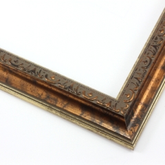 This classic, Victorian-style frame features a solid wood, reverse scoop profile.  The relief-detailed inner lip and sloped face are a mottled bronze foil, edged in a subtle bevel.

1.25 " width: ideal for small images. Border an acrylic or oil painting or print with this antiqued, high fashion frame.