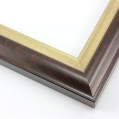 This solid wood frame features an elegant curve-and-scoop profile that draws the eye inward.  The outer edge maintains the natural wood grain, and slightly distressed gold foil on the inner lip adds a subtle antique finish. The outside rim is an unobtrusive black.

1.75 " width: suitable for both medium and large images.