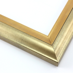 This high shine, gold and bronze foil wood frame features an elegant curve-and-scoop profile that draws the eye inward.  Slight distressing on the gold, and dark grey along the stepped ridge add a subtle antique finish.

1.75 " width: suitable for both medium and large images.  A striking border for a black and white photograph, or to highlight a classic painting or Giclée print.