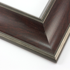 This bold frame features a steep reverse scoop profile with a mahogany wash that highlights the natural wood grain.  The inner lip drops sharply in toward the image; both edges are brushed with a subtle silver leaf.

3 " width: ideal for large or oversize artwork. Select a strong image for this frame, to ensure the heavy border doesn