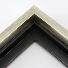 This solid wood canvas floater frame features a glossy brushed silver on the outside edge and topmost face.  The inside step and base are a matte black. 

Display your favourite gallery wrapped Giclée print or painting with authentic, fine art style. This floater frame is ideal for medium to extra large canvases mounted on thick (1.5 " deep) stretcher bars.

*Note: These solid wood, custom canvas floaters are for stretched canvas prints and paintings, and raised wood panels.