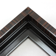 This solid wood canvas floater frame features a high shine, deep walnut finish with striped wood grain detailing on the outside edge and topmost face.  The inside step and base are a glossy black. 

Display your favourite gallery wrapped Giclée print or painting with authentic, fine art style. This floater frame is ideal for small to extra large canvases mounted on thick (1.5 " deep) stretcher bars.

*Note: These solid wood, custom canvas floaters are for stretched canvas prints and paintings, and raised wood panels.