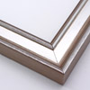 This frame features a deep crown moulding profile finished in silver leaf.  An antique look is achieved with a gentle brushed effect that highlights the corners of the bevelled edges.

2.125 " width and 1.25 " depth: ideal for medium to large images.  Border a black-dominant grayscale photograph or acrylic painting with this stylishly simple frame.