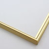 This simple metal picture frame has a bold, high-shine gold finish and curved profile. The outer drop edge has a tiny vertical ridge texture. 

.375 " width: ideal for small, medium or large artworks. Easily frame photographs, paintings or drawings on paper, or even Giclée canvas prints.