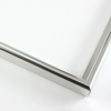 This simple metal picture frame has a bold, high-shine silver finish with a brushed outer drop edge and curved profile. 

.375 " width: ideal for small, medium and large artworks. Easily frame photographs, thicker cloth or needlework art, or even Giclée canvas prints.