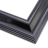 This simple, reverse scoop frame features a bevelled outer edge smoothly curving inner lip.  The high shine of the black results in a unique, modern flare.

2.5 " width: ideal for medium or large images. Pair with a contemporary painting or Giclée print, or a bold, greyscale photograph.