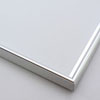 This simple metal picture frame has a silver, high-shine finish, brush-textured drop edge and a curved profile.

.375 " width: ideal for small and medium artworks. Easily frame photographs, thicker cloth or needlework art, or even Giclée canvas prints.