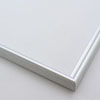 This simple metal picture frame has a smooth, frosted silver finish, brush-textured drop edge and a curved profile.

.375 " width: ideal for small and medium artworks. Easily frame photographs, thicker cloth or needlework art, or even Giclée canvas prints.
