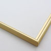 This simple metal picture frame has a smooth, frosted gold finish, brush-textured drop edge and a curved profile.

.375 " width: ideal for small and medium artworks. Easily frame photographs, thicker cloth or needlework art, or even Giclée canvas prints.